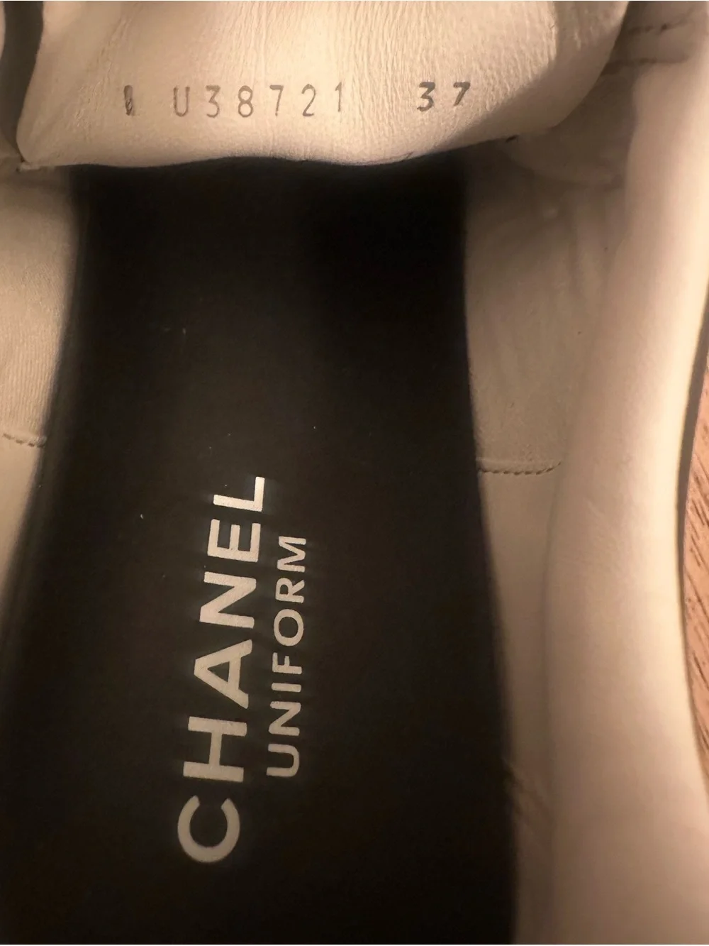 CHANEL Black Leather Low-Top Sneaker with White Sole